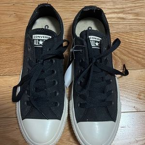 Brand new converse shoes with eyelet holes on the sides